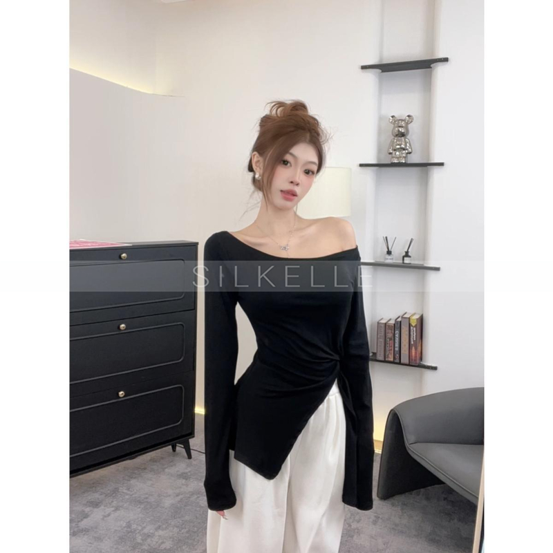 Irregular side slits, slim waist, slightly transparent long sleeves, elegant slim fit top